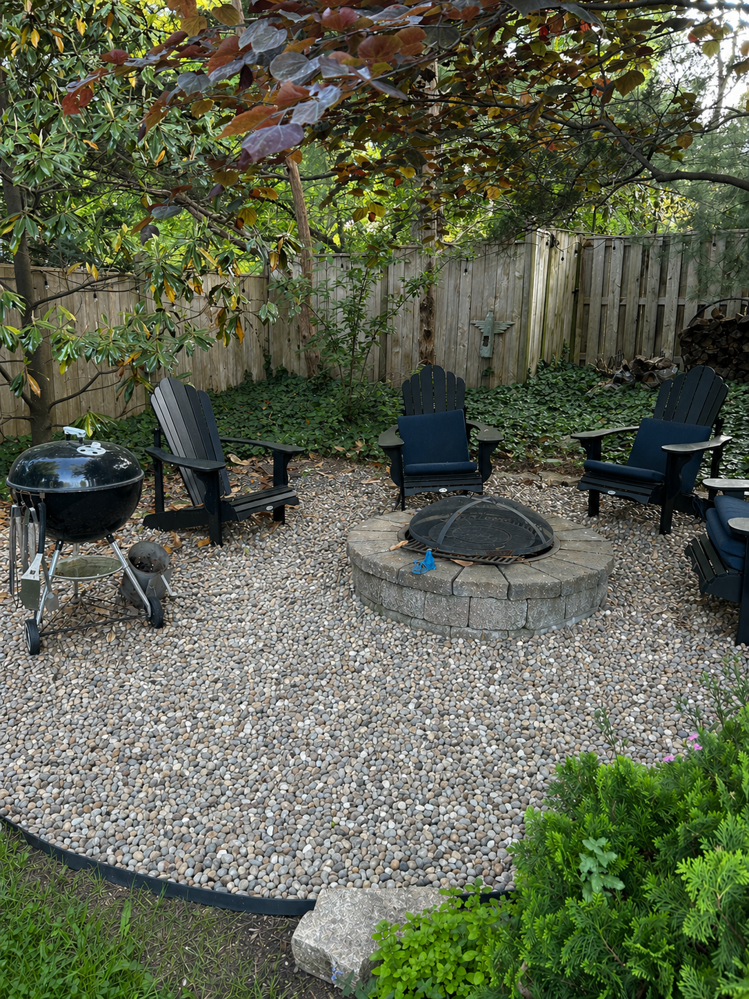 Custom Fire Pit Installation and River rock seating area with natural edging